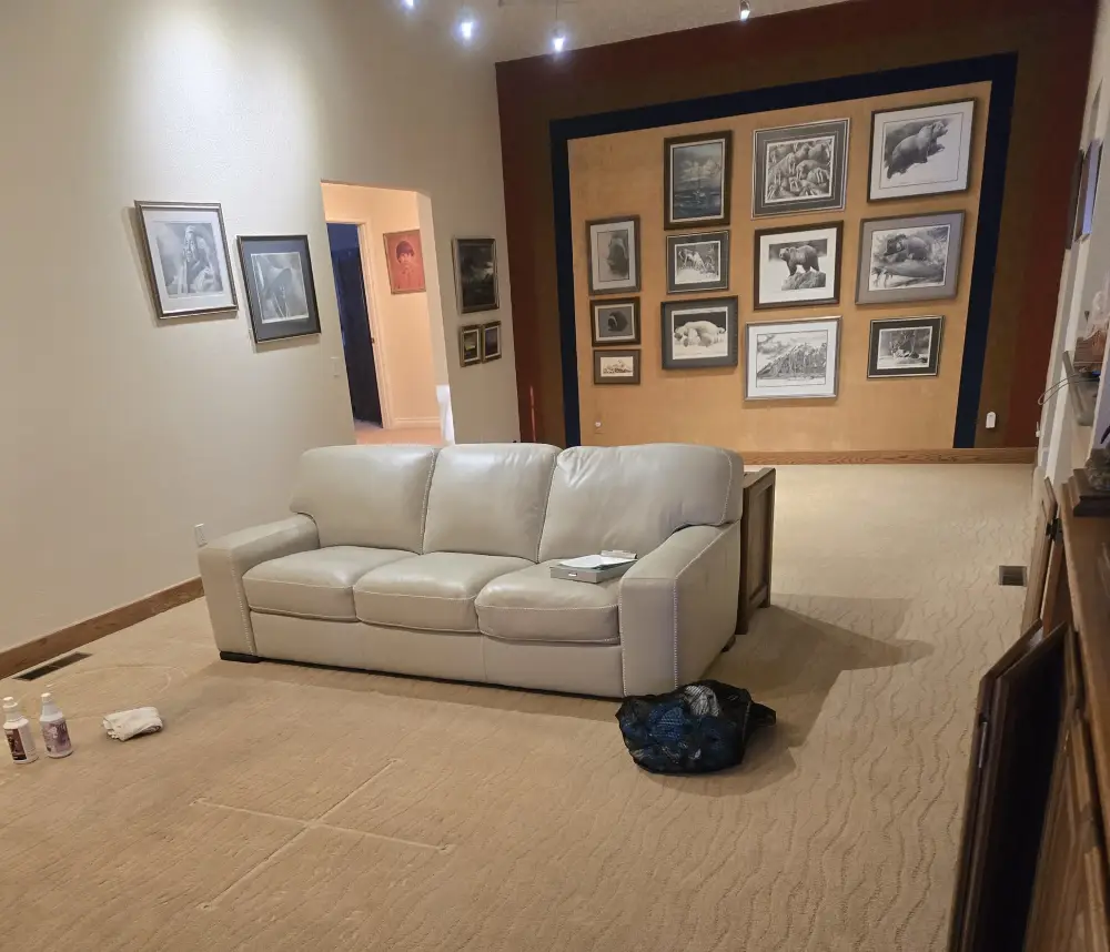 Cream leather sofa in an Anchorage living room after cleaning and conditioning