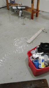 Extraction equipment set up on a wet floor during drying
